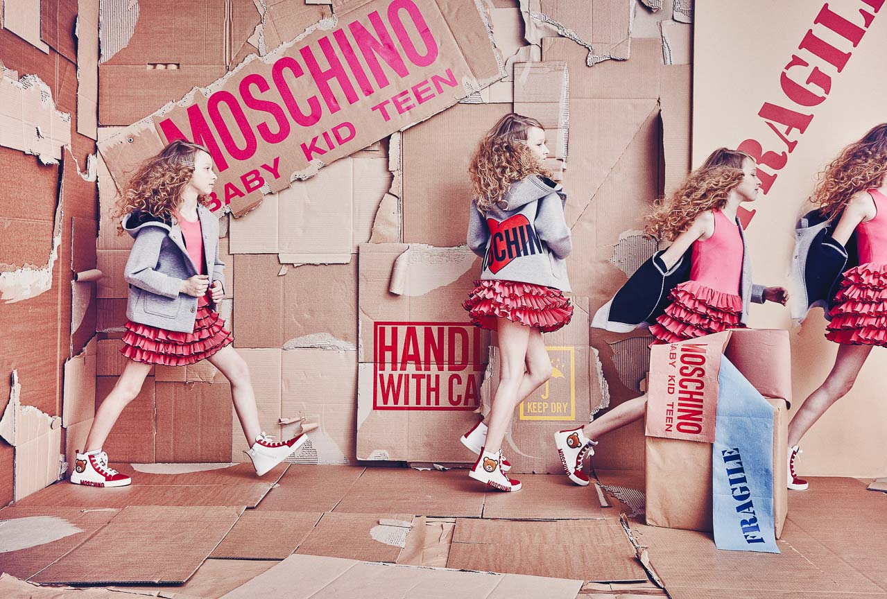 Moschino Baby Kid Teen campaign girls red ruffled skirts cardboard set - photographer Federico Leone Milano